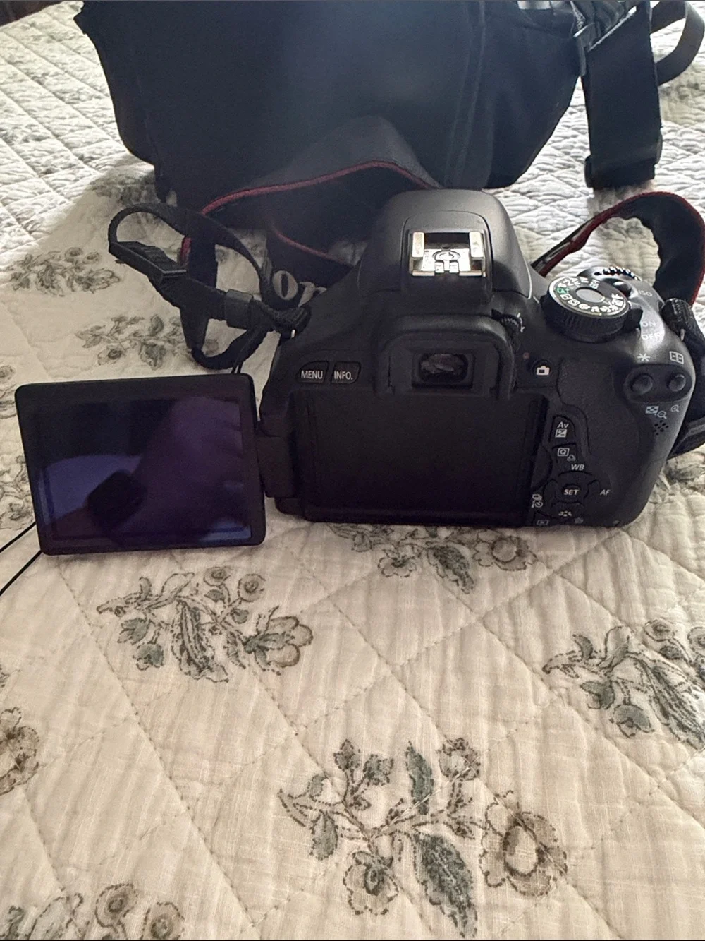 Canon DSLR Camera with Black Body and Red-Trim Strap